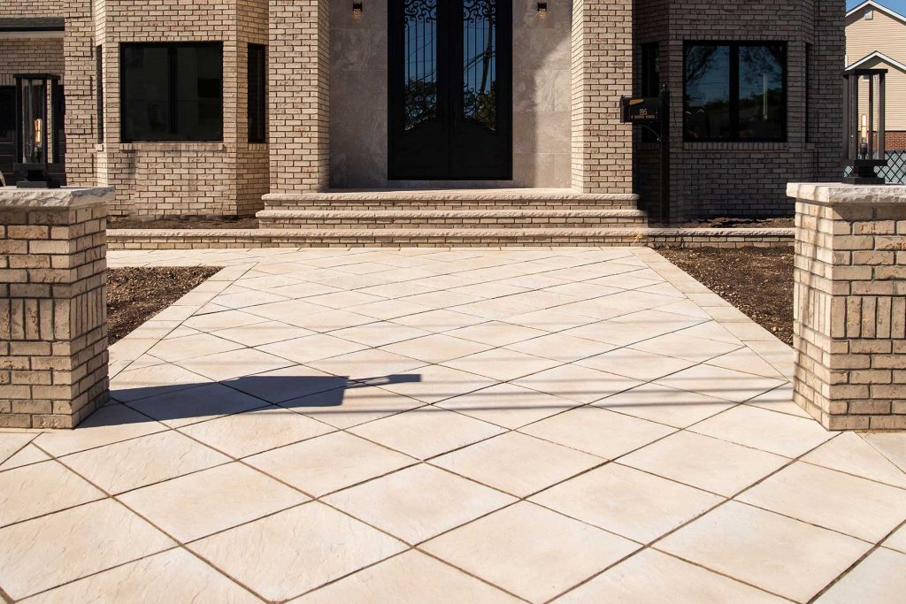 Natural Cleft Flagstone pairs textured surfaces with defined edges, giving this patio traditional stone character within an organized layout.